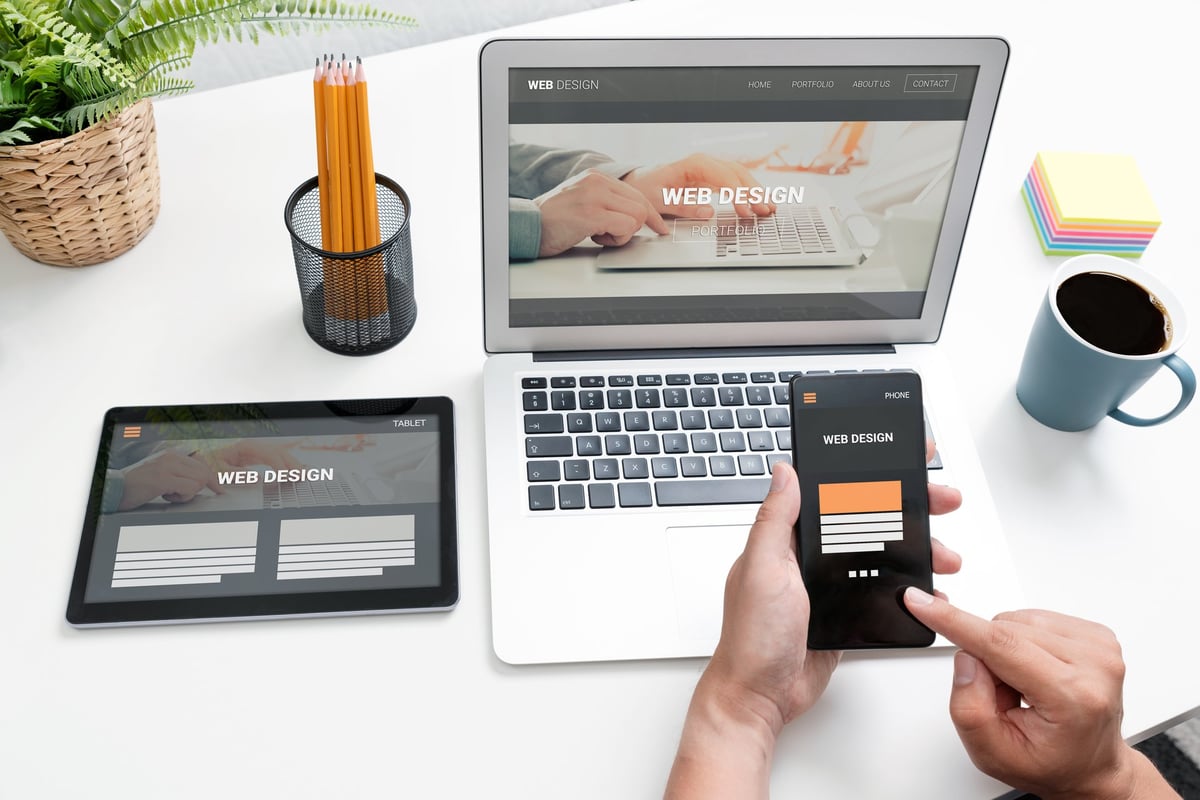Web developer designing responsive websites for devices