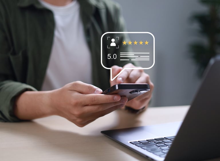 Businessman uses smartphone to provide five-star feedback for customer satisfaction survey